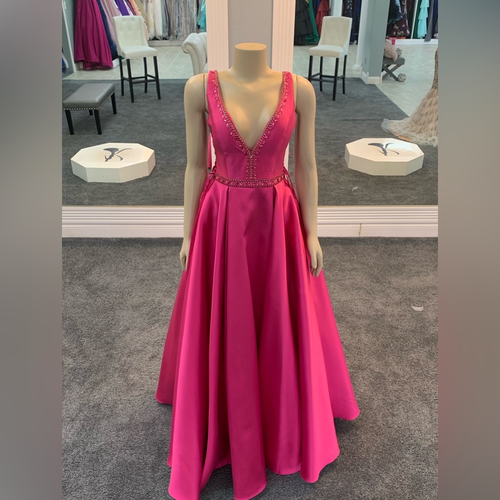 size 8 fuchsia color. beaded design. crisscross sides. pockets. ballgown